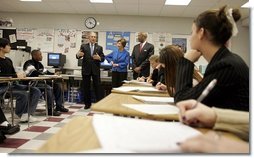 President George W. Bush, Mrs. Laura Bush and Secretary of Education Rod Paige talk to international baccalaureate program students of J.E.B. Stuart High School in Falls Church, VA on January 12, 2005.  White House photo by Paul Morse