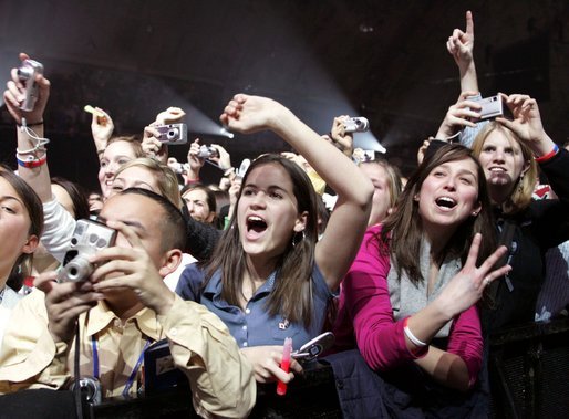 Young supporters of President George W. Bush attend the pre-inaugural event 'America's Future Rocks Today- A Call to Service' youth event at the DC Armory in Washington, D.C., Tuesday, Jan. 18, 2005. The event featured messages from celebrities and musical performances by musicians Hillary Duff, Fuel, JoJo and others. White House photo by Susan Sterner