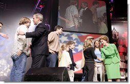 President George W. Bush and Laura Bush greet participants at the 'America's Future Rocks Today- A Call to Service' youth event at the DC Armory in Washington, D.C., Tuesday Jan. 18, 2005.  White House photo by Susan Sterner