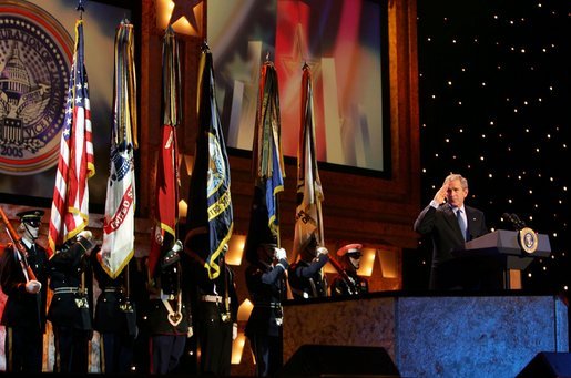 President George W. Bush salutes guests attending a pre-inaugural event honoring the men and women of the U.S. military at the MCI Center in Washington, D.C., Tuesday, Jan. 18, 2005. Fourteen thousand guests attended the event, including 7,000 military service members, wounded soldiers from Walter Reed Army Medical Center, families of fallen soldiers and Congressional Medal of Honor winners. White House photo by David Bohrer