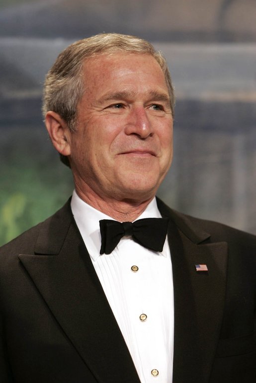 President George W. Bush listens as Vice President Dick Cheney introduces him during a Black Tie and Boots Ball in Washington, D.C., Jan 19, 2005. Chief Justice William Rehnquist will swear President Bush into office to serve his second term during the 55th Presidential Inauguration held Jan. 20, 2005. White House photo by Eric Draper