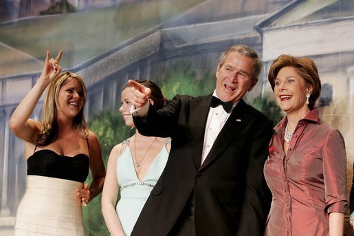 With his twin daughters Jenna, left, and Barbara by his side, President George W. Bush points out members of the audience to Laura Bush during a Black Tie and Boots Inaugural Ball in Washington, D.C., Wednesday, Jan. 19, 2005. White House photo by Eric Draper