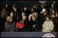 President George W. Bush and Laura Bush sit with Vice President Dick Cheney, Lynne Cheney, and their granddaughter, Grace Perry, during a concert commemorating the 55th Presidential Inauguration on the Ellipse in Washington, D.C., Wednesday, Jan. 19, 2005. White House photo by Eric Draper