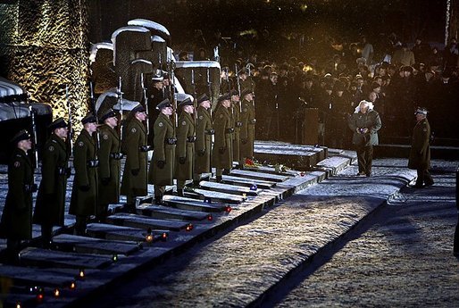 Vice President Dick Cheney walks to place a candle on a memorial tablet in the former Nazi concentration camp of Auschwitz-Birkenau in Oswiecim, Poland, Thursday, Jan. 27, 2005. Vice President Cheney attend a number of ceremonies throughout the day, commemorating the 60th Anniversary of the Liberation of the Auschwitz-Birkenau Concentration Camp. White House photo by David Bohrer