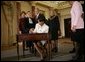 Secretary of State Dr. Condoleezza Rice signs official papers Friday, Jan. 28, 2005, after receiving the oath of office during her ceremonial swearing in at the Department of State. Watching on are, from left, Laura Bush, Justice Ruth Bader Ginsburg, President George W. Bush and an unidentified family member. White House photo by Eric Draper