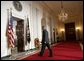 President George W. Bush leaves the podium after delivering a statement on Iraq's elections from the Cross Hall of the White House, Sunday, Jan. 30, 2005. White House photo by Eric Draper.