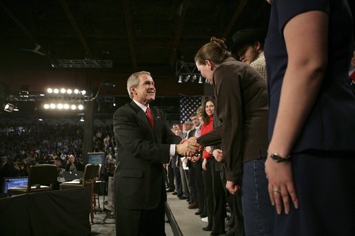 President George W. Bush greets audience members after holding a conversation about the strengthening of Social Security at ExpoPark in Great Falls, Mont., Feb., 3, 2005. "I believe you ought to be able -- allowed to take some of your own money, payroll taxes, and set up a personal retirement account, on a voluntary basis," said the President in his remarks. White House photo by Eric Draper