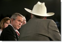 President George W. Bush listens to retired senior citizen Leo Keller during a Town Hall meeting about the strengthening of Social Security at the Montana ExpoPark in Great Falls, Mont., Thursday, Feb. 3, 2005.  White House photo by Eric Draper