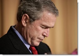 President George W. Bush bows his head in prayer during the National Prayer Breakfast in Washington, D.C., Thursday, Feb. 3, 2005.  White House photo by Paul Morse