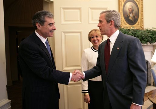 President George W. Bush welcomes Secretary of Commerce Carlos Gutierrez and his wife Edilia Gutierrez to the Oval Office Monday, Feb. 7, 2005. Mr. Gutierrez, a native of Cuba and former chairman of the board and chief executive officer of the Kellogg Company, was sworn in by White House Chief of Staff Andrew Card earlier in the day. White House photo by Eric Draper