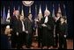 Justice Sandra Day O'Connor introduces Alberto Gonzales to the audience after administering the oath of office to him during ceremonies welcoming him to his new post of U.S. Attorney General. Joining President George W. Bush in the proceedings are members of Mr. Gonzales' family. White House photo by Paul Morse.