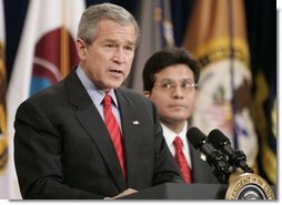 Attorney General Alberto Gonzales looks on as President Bush delivers remarks Monday, Feb. 14, 2005, during Mr. Gonzales's ceremonial swearing in.  White House photo by Paul Morse