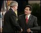 Attorney General Alberto Gonzales receives congratulations from President Bush during ceremonies Monday, Feb. 14, 2005, marking Mr. Gonzales's new post. White House photo by Paul Morse