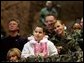 Audience members listen to a speech by Laura Bush praising the sacrifice and hard work of the U.S. military and their families Tuesday, Feb. 22, 2005 at Ramstein Air Base in Ramstein, Germany. White House photo by Susan Sterner