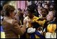 Laura Bush signs autographs for students of General H. H. Arnold High School following her remarks there to students, faculty and parents of the military in Wiesbaden, Germany, Tuesday, Feb. 22, 2005. White House photo by Susan Sterner