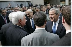 President George W. Bush and Secretary of Homeland Security Michael Chertoff greet the crowd at the Ronald Reagan Building and International Trade Center in Washington, D.C. after Chertoff’s swearing-in ceremony Thursday, Mar. 3, 2005.  White House photo by Paul Morse