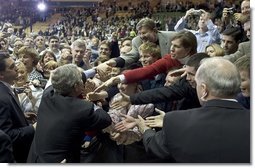 President George W. Bush greets the crowd after a conversation on strengthening Social Security on the University of Notre Dame campus in South Bend, Indiana on Friday, March 4, 2005.  White House photo by Paul Morse