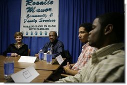 Laura Bush talks with young fathers who have turned their lives around with the help of the Today's Dad program at Rosalie Manor Community and Family Services center in Milwaukee, Wis., Tuesday, March 8, 2005.  White House photo by Susan Sterner