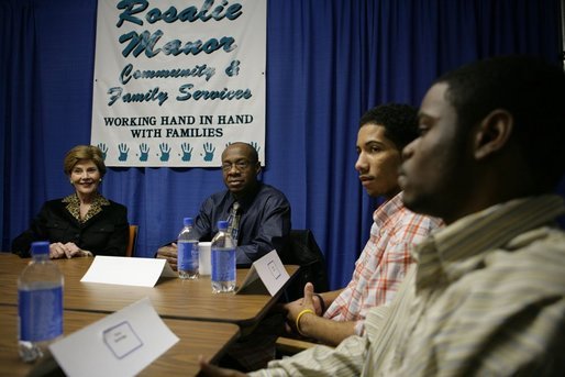 Laura Bush talks with young fathers who have turned their lives around with the help of the Today's Dad program at Rosalie Manor Community and Family Services center in Milwaukee, Wis., Tuesday, March 8, 2005. White House photo by Susan Sterner