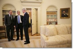 President George W. Bush listens to a report from former President George H. W. Bush and former President Bill Clinton on their recent tour of Asian nations hit by the Dec. 26, 2004 tsunami.  White House photo by Eric Draper