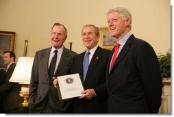 Former President George H. W. Bush, left, and former President Bill Clinton, right, join President George W. Bush in the Oval Office Tuesday, March 8, 2005 to report on their recent tour of the tsunami devastated areas in Asia.  White House photo by Eric Draper