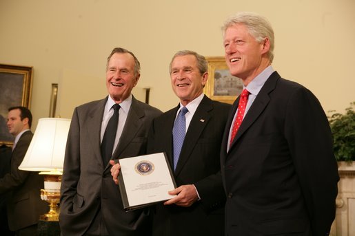 Former President George H. W. Bush, left, and former President Bill Clinton, right, join President George W. Bush in the Oval Office Tuesday, March 8, 2005 to report on their recent tour of the tsunami devastated areas in Asia. White House photo by Eric Draper