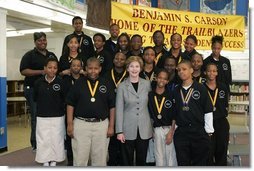 Laura Bush attends the Helping America's Youth Event at the Benjamin S. Carson Honors Preparatory School, Atlanta, Georgia, with debate class, March 9, 2005.  White House photo by Susan Sterner