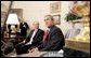 President George W. Bush and Romanian President Traian Basescu take questions from the media in the Oval Office Wednesday, March 9, 2005. White House photo by Paul Morse