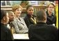 Laura Bush attends the Helping America's Youth Event at the Benjamin S. Carson Honors Preparatory School, Atlanta, Georgia, March 9, 2005, visiting a debate class with U.S. Education Secretary Margaret Spellings. White House photo by Susan Sterner