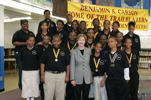 Laura Bush attends the Helping America's Youth Event at the Benjamin S. Carson Honors Preparatory School, Atlanta, Georgia, with debate class, March 9, 2005. White House photo by Susan Sterner