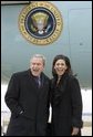 President George W. Bush laughs with USA Freedom Corps greeter Monica Hardin in front of Air Force One in Louisville, Ky., Thursday, March 10, 2005. White House photo by Paul Morse