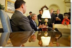 President George W. Bush and His Majesty King Abdullah of Jordan talk with reporters in the Oval Office Tuesday, March 15, 2004.  White House photo by Paul Morse