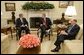 President George W. Bush meets with Deputy Secretary of Defense Paul Wolfowitz and Secretary of Treasury John Snow in the Oval Office Wednesday, March 16, 2005. White House photo by Paul Morse