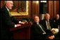 President George W. Bush and Speaker of the House Dennis Hastert, right, listen to remarks by Irish Prime Minister Bertie Ahern during a St. Patrick's Day Luncheon at the U.S. Capitol Thursday, March 17, 2005. White House photo by Krisanne Johnson