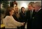 The fiancée and two sisters of Robert McCartney, a Catholic man who was killed in January, meet with President George W. Bush and Irish Prime Minister Bertie Ahern in the Diplomatic Reception Room at the White House Thursday, March 17, 2005. From left, they are: sister Paula Arnold; fiancée Bridgeen Hagans; sister Catherine McCartney; and Irish Prime Minister Bertie Ahern. White House photo by Eric Draper