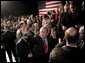 President George W. Bush waves to the crowd at the end of his ‘Conversation on Strengthening Social Security’ Monday, March 21, 2005, in Denver. The President took his plans for reform to an estimated 1,200 guests at the Wings Over the Rockies Air and Space Museum. White House photo by Eric Draper