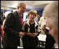 President George W. Bush shares a light moment with seniors at Tucson’s Morris K. Udall Center during his early morning visit Monday, March 21, 2005. The president made the recreational center his first Arizona stop and spoke to seniors there about his plans for strengthening Social Security. White House photo by Eric Draper