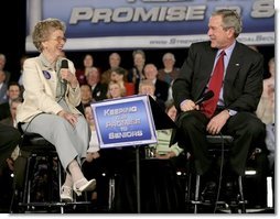 Tucson resident Mary-Margaret Raymond smiles as she speaks to President George W. Bush about Social Security issues during the president's visit to her home town Monday, March 21, 2005. The 84-year-old retired county administrator told the president that Social Security had become an important part of her retirement income and she had no fear that it would be impacted by reform.  White House photo by Eric Draper