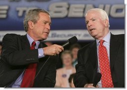 President George W. Bush shares the microphone with Senator John McCain, R-Ariz., as they speak to an audience at the Tucson Convention Center Monday, March 21, 2005, about strengthening Social Security.  White House photo by Eric Draper