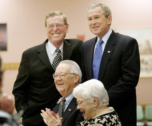 President George W. Bush and Senator Pete Domenici, R-NM., visit with breakfast guests at Bear Canyon Senior Center, Tuesday, March 22, 2005, in Albuquerque. The two visited with more than 30 seniors who were on hand to hear the president’s proposals for Social Security reform. White House photo by Eric Draper