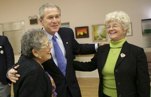 President George W. Bush greets Millie Martinez, right, and Ida Gonzalez at Bear Canyon Senior Center in Albuquerque, Tuesday, March 22, 2005, as he took his Conversation for Strengthening Social Security into New Mexico. The president reassured the approximately 30 breakfast guests that those born before 1950 will be unaffected by proposed reforms to the program. White House photo by Eric Draper