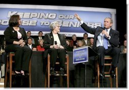 President George W. Bush talks with grandmother Margaret Valdez, center, and her granddaughter Jessica Valdez during a Conversation on Strengthening Social Security in Albuquerque, N.M., Tuesday, March 23, 2005.  White House photo by Eric Draper