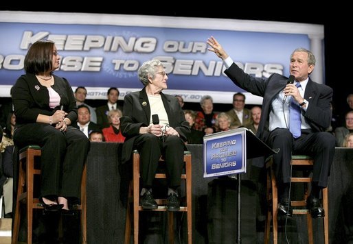 President George W. Bush talks with grandmother Margaret Valdez, center, and her granddaughter Jessica Valdez during a Conversation on Strengthening Social Security in Albuquerque, N.M., Tuesday, March 23, 2005. White House photo by Eric Draper