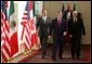 President George W. Bush walks with Mexico President Vicente Fox, left, and Canadian Prime Minister Paul Martin upon their arrival Wednesday, March 23, 2005, at the Bill Daniels Activity Center at Baylor University in Waco, Texas. White House photo by Eric Draper