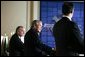 President George W. Bush smiles during a joint press conference Wednesday, March 23, 2005, after talks with Canada's Prime Minister Paul Martin, left, and Mexico's President Vicente Fox at the Bill Daniels Activity Center on the campus of Baylor University in Waco, Texas. White House photo by Krisanne Johnson