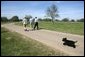 As Barney follows along, President George W. Bush walks with Canadian Prime Minister Paul Martin, left, and Mexican President Vicente Fox in Crawford, Texas, March 23, 2005. White House photo by Eric Draper White House photo by Eric Draper