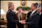 Meeting with citizens from Iraq, President George W. Bush talks with Maurice Shohet and Ali Alattar, center, in the Oval Office Tuesday, March 29, 2005. White House photo by Eric Draper