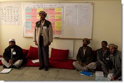 A man studying to be a teacher stands to introduce himself during a visit by Mrs. Bush to Kabul University in Kabul, Afghanistan, Wednesday, March 30, 2005.  White House photo by Susan Sterner