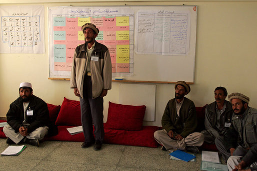 A man studying to be a teacher stands to introduce himself during a visit by Mrs. Bush to Kabul University in Kabul, Afghanistan, Wednesday, March 30, 2005. White House photo by Susan Sterner