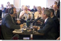 President George W. Bush and Sen. Chuck Grassley, R-Iowa, participate in an interview with radio talk show host Jan Mickelson at the Spring House Family Restaurant in Cedar Rapids, Iowa, March 30, 2005. White House photo by Paul Morse